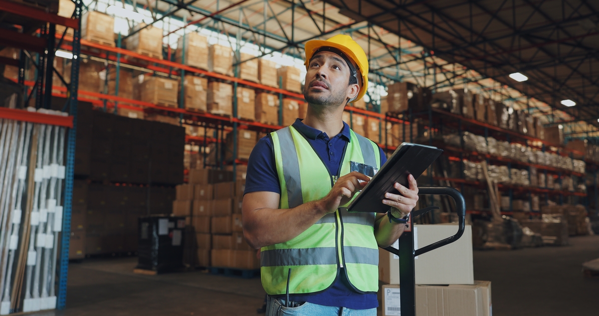 Warehouse,,Man,And,Tablet,In,Factory,For,Logistics,,Orders,And