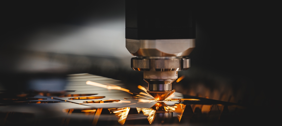 Laser,Cnc,Cut,Of,Metal,With,Light,Spark.,Industry,Background