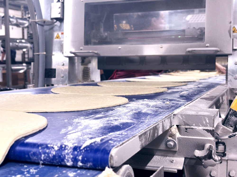 An oil-flooded screw compressor with food-grade lubricant works for The Fire Roasted Crust Co. in Wexford, PA, because the air does not come into contact with the food products.